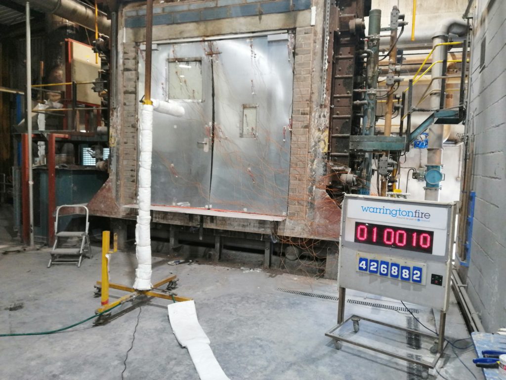Rhino Doors’ El260 reaching the hour mark during its fire test at Warringtonfire where the door protected against temperatures reaching 945oC.)